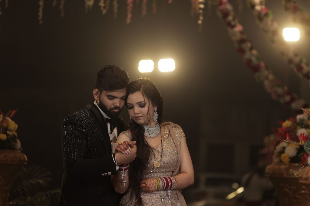 A beautifully captured moment of a couple at an elegant wedding reception, expressing love.